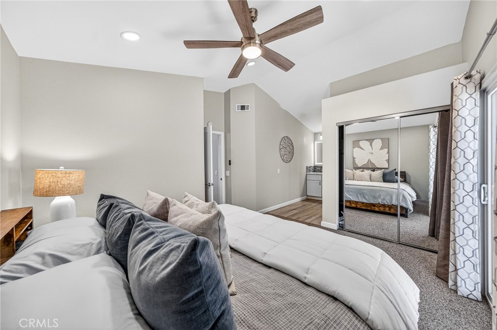 9290 Hot Springs Road Corona, CA 92883 - Photo 15 of 25 a bedroom with a bed and a chandelier