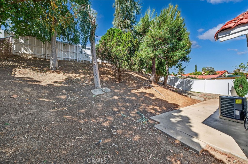 9290 Hot Springs Road Corona, CA 92883 - Photo 20 of 25 a view of a backyard with trees