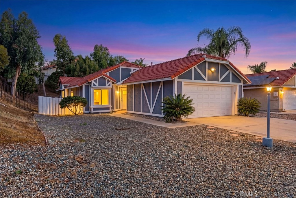 9290 Hot Springs Road Corona, CA 92883 - Photo 21 of 25 a front view of a house with garden