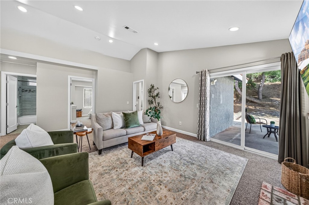9290 Hot Springs Road Corona, CA 92883 - Photo 4 of 25 a living room with furniture and a table