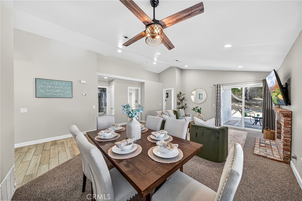9290 Hot Springs Road Corona, CA 92883 - Photo 5 of 25 a view of a dining room with furniture window and wooden floor