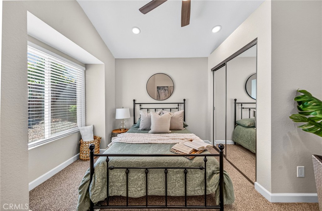 9290 Hot Springs Road Corona, CA 92883 - Photo 9 of 25 a bedroom with a bed and a large window with outer view