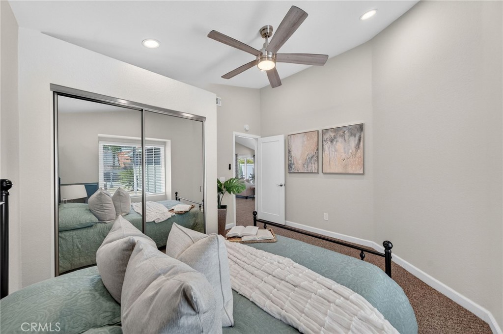 9290 Hot Springs Road Corona, CA 92883 - Photo 10 of 25 a bed room with a bed and a couch