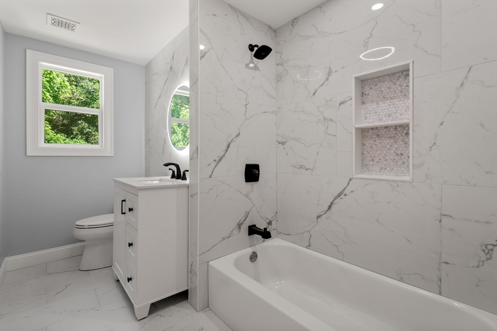 456 Parsonage Street Marshfield, MA 02050 - Photo 11 of 41 a bathroom with a bathtub sink and toilet