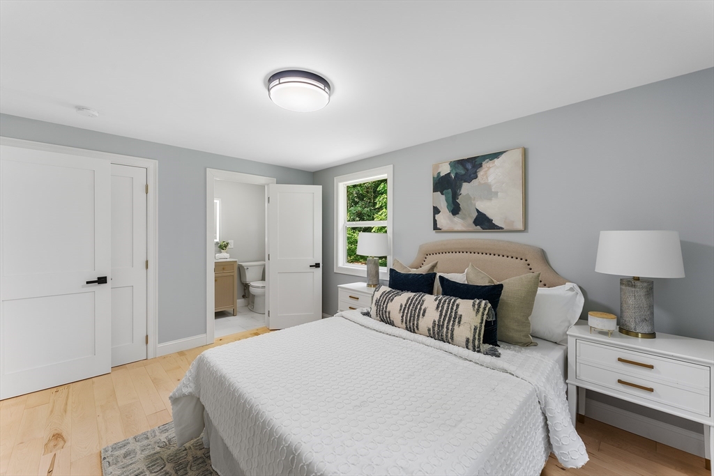 456 Parsonage Street Marshfield, MA 02050 - Photo 13 of 41 a bedroom with a bed and a lamp