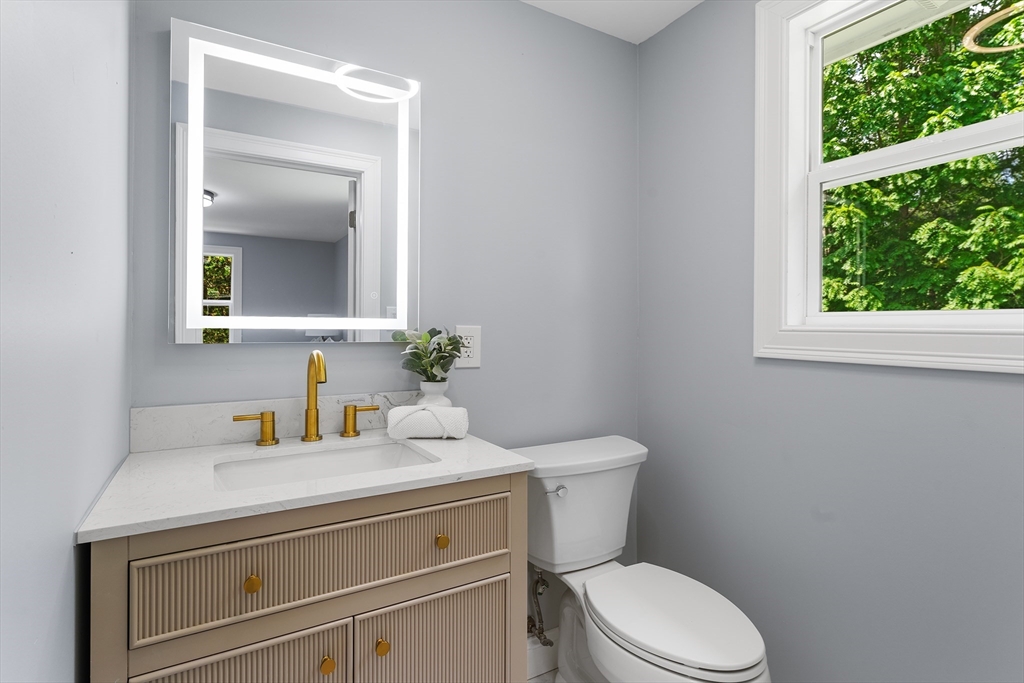 456 Parsonage Street Marshfield, MA 02050 - Photo 14 of 41 a bathroom with a toilet a sink and a window