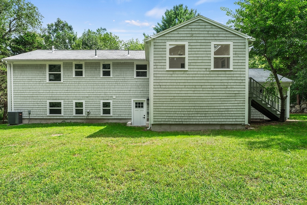 456 Parsonage Street Marshfield, MA 02050 - Photo 20 of 41 a front view of a house with a yard