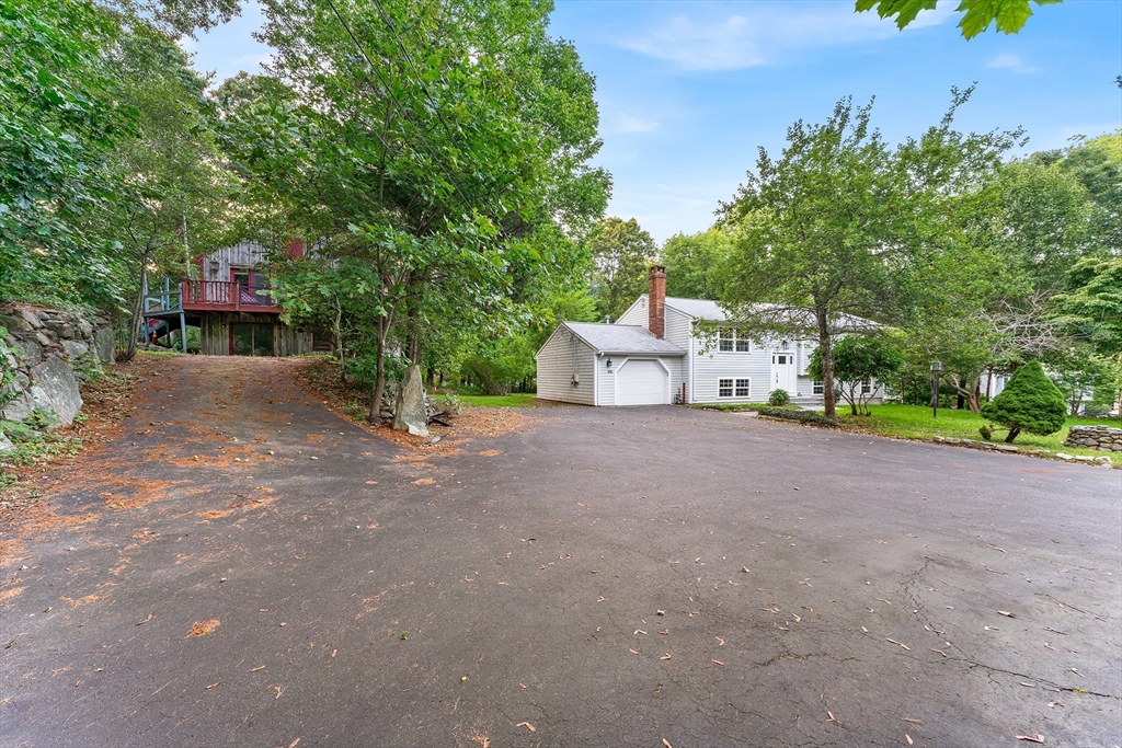 456 Parsonage Street Marshfield, MA 02050 - Photo 22 of 41 a view of a house with backyard and trees