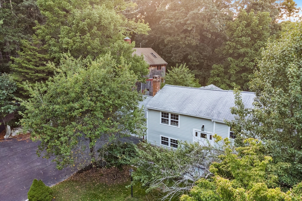 456 Parsonage Street Marshfield, MA 02050 - Photo 38 of 41 an aerial view of a house with yard and trees in the background