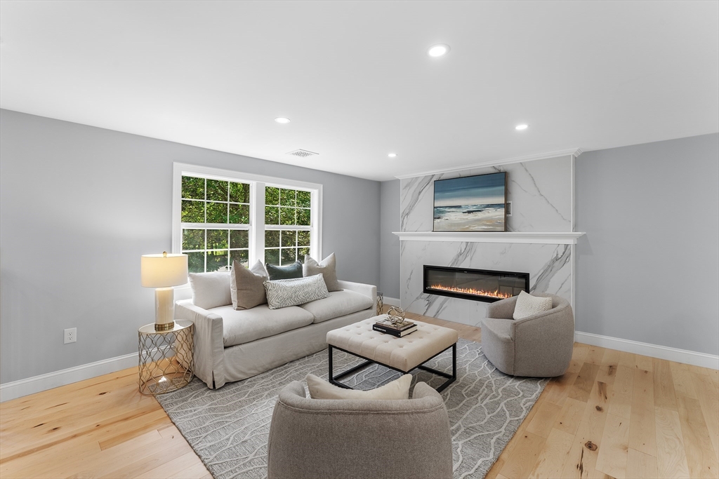 456 Parsonage Street Marshfield, MA 02050 - Photo 9 of 41 a living room with furniture and a fireplace