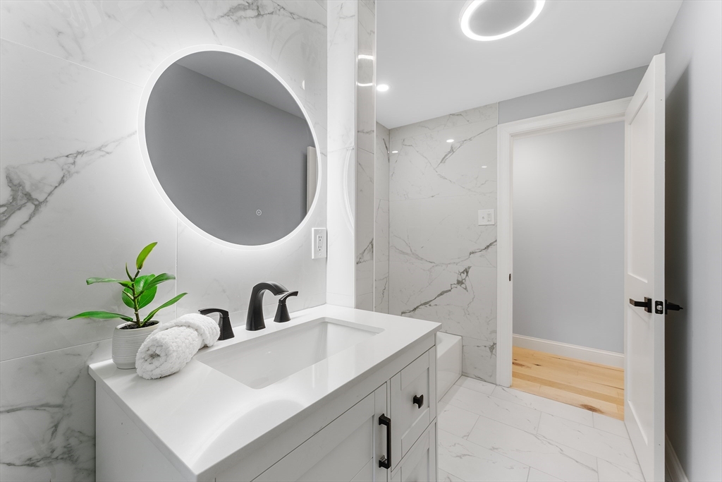 456 Parsonage Street Marshfield, MA 02050 - Photo 10 of 41 a bathroom with a sink and a mirror