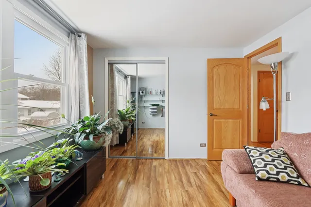 a bedroom with furniture and a window