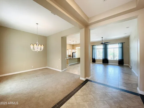 a view of kitchen with refrigerator and window