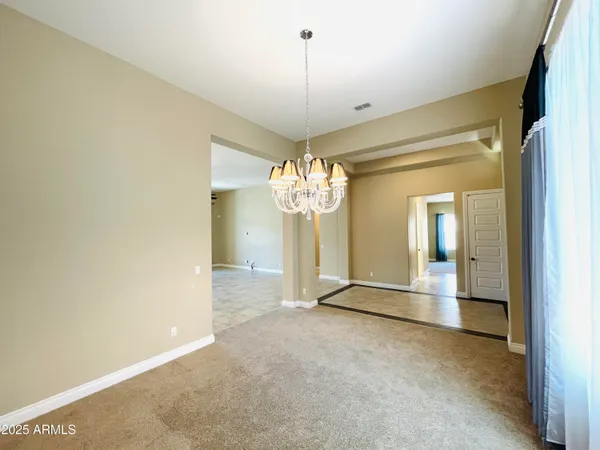 a large bathroom with a large tub and cabinets