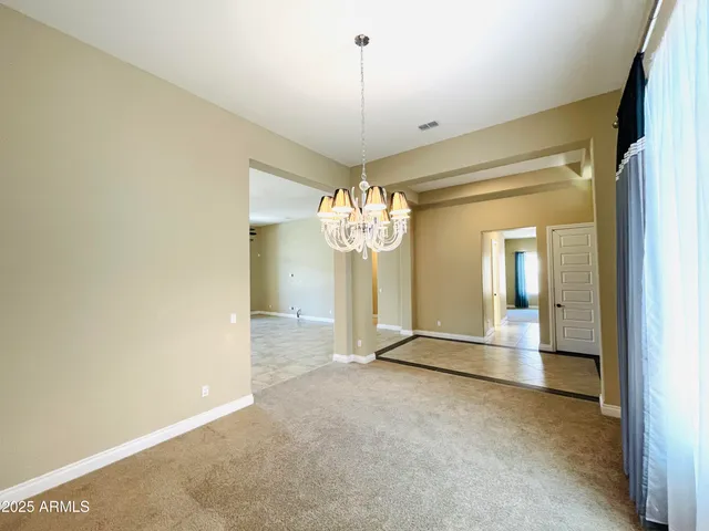 a large bathroom with a large tub and cabinets