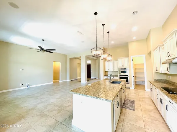 a kitchen with stainless steel appliances a stove and a refrigerator