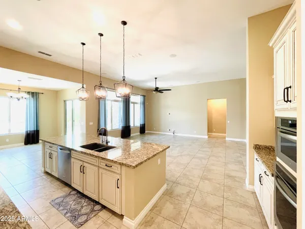 a bathroom with a sink a toilet and shower curtain