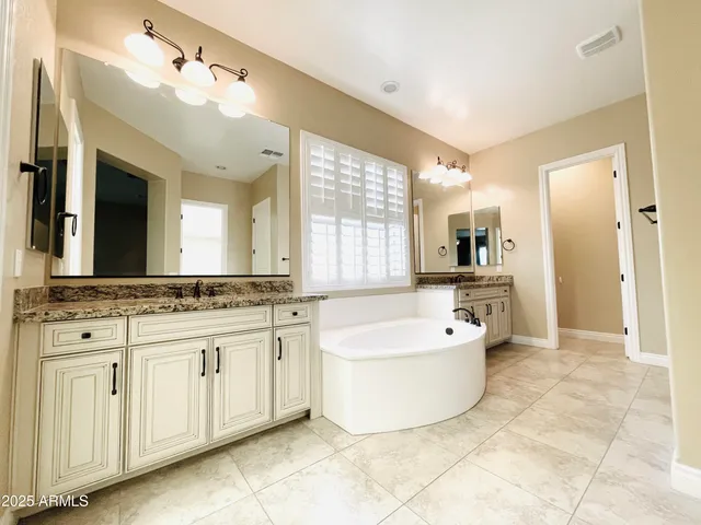 a kitchen with a cabinets and wooden floor