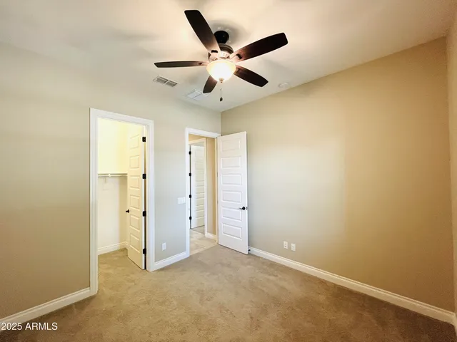 a view of livingroom with hardwood floor and kitchen view