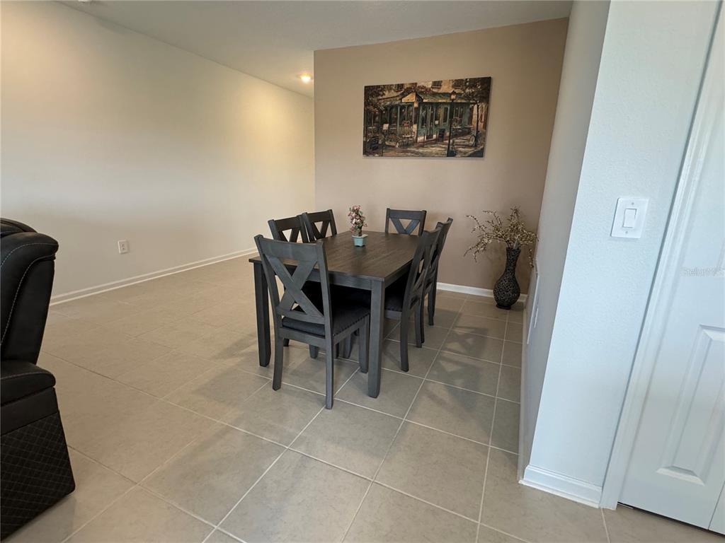 2405 Bluestone Road Haines City, FL 33844 - Photo 8 of 18 a view of a dining room with furniture