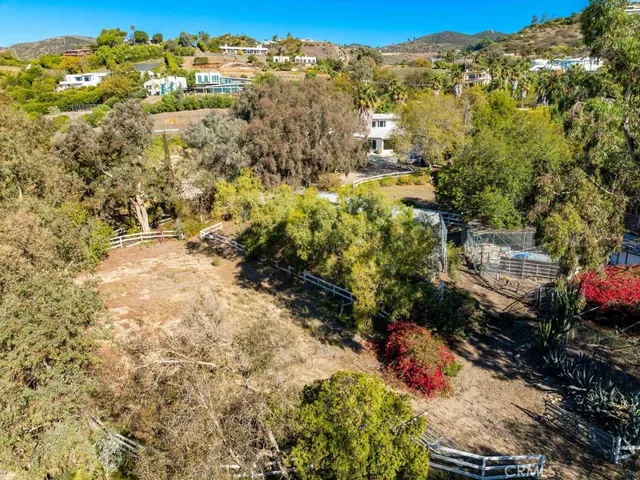a view of a city with lush green forest