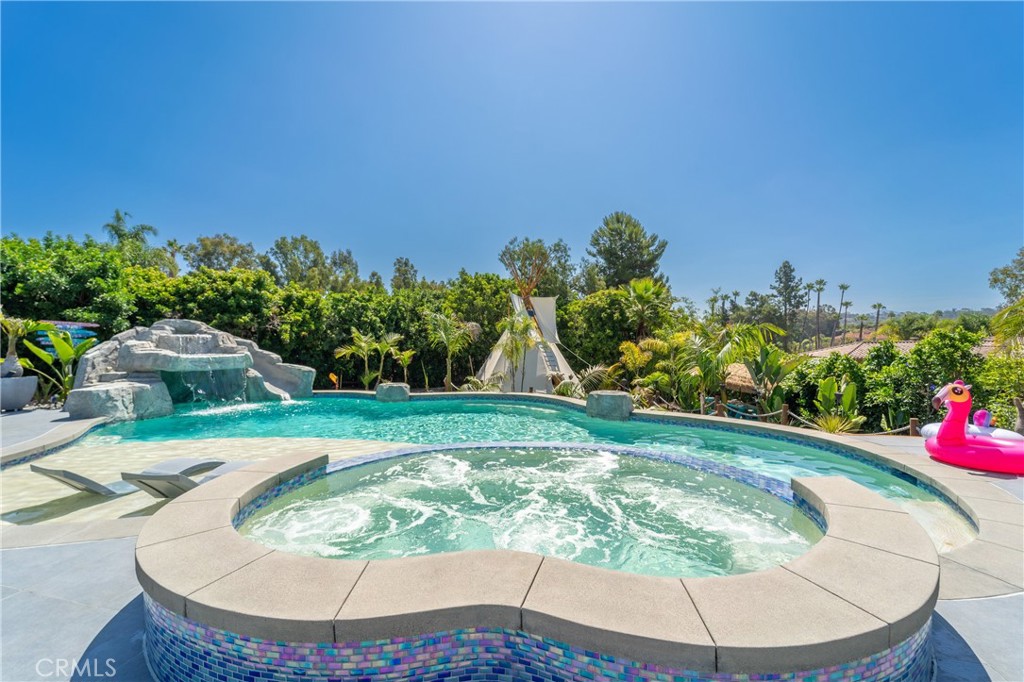 7337 La Soldadera Rancho Santa Fe, CA 92067 - Photo 48 of 60 a view of a backyard with potted plants