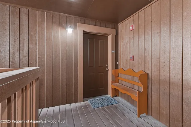 a room with a chair and wooden floor