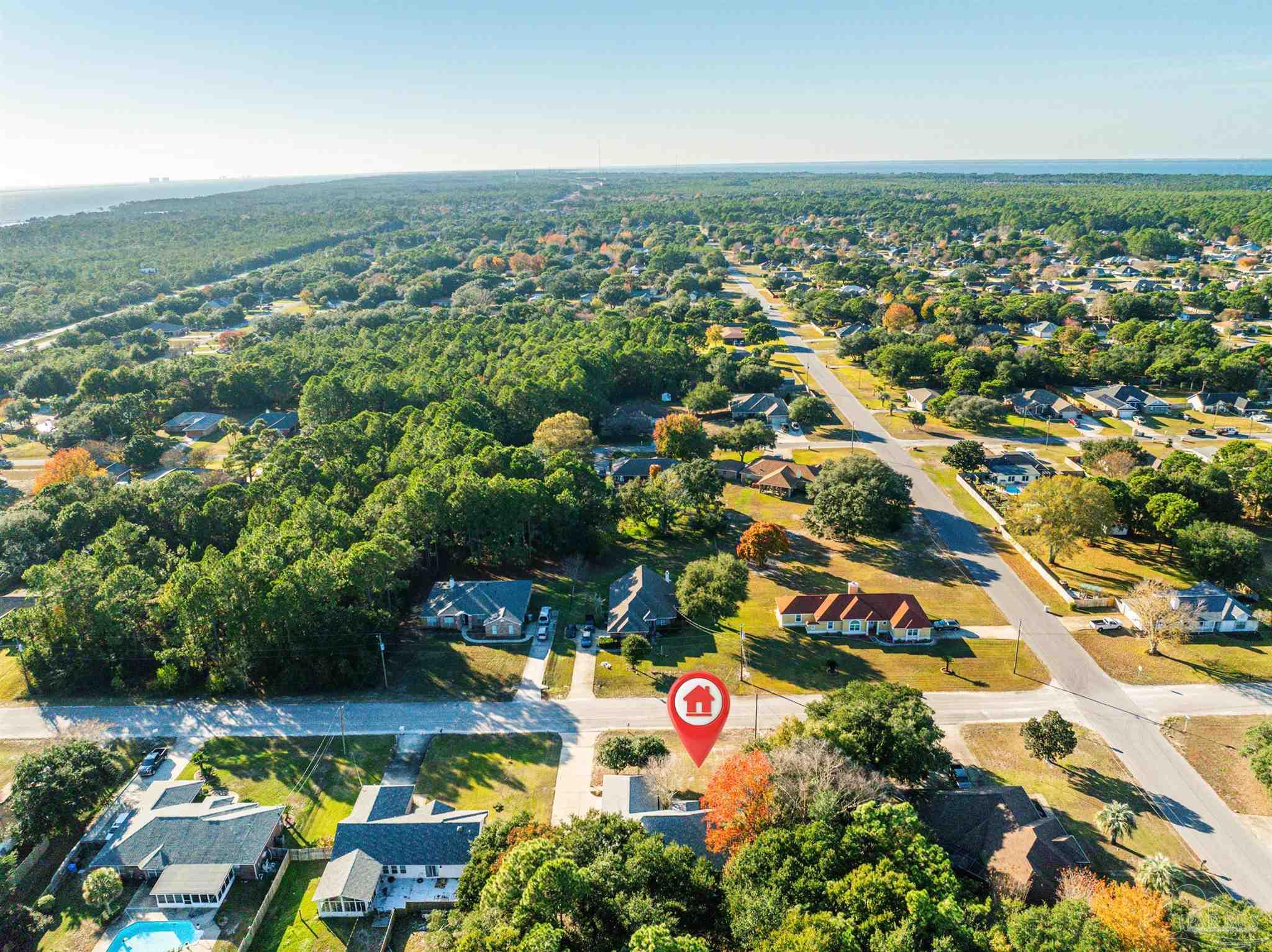 1860 Sparrow Lane Navarre, FL 32566 - Photo 12 of 43 an aerial view of residential houses with outdoor space and swimming pool