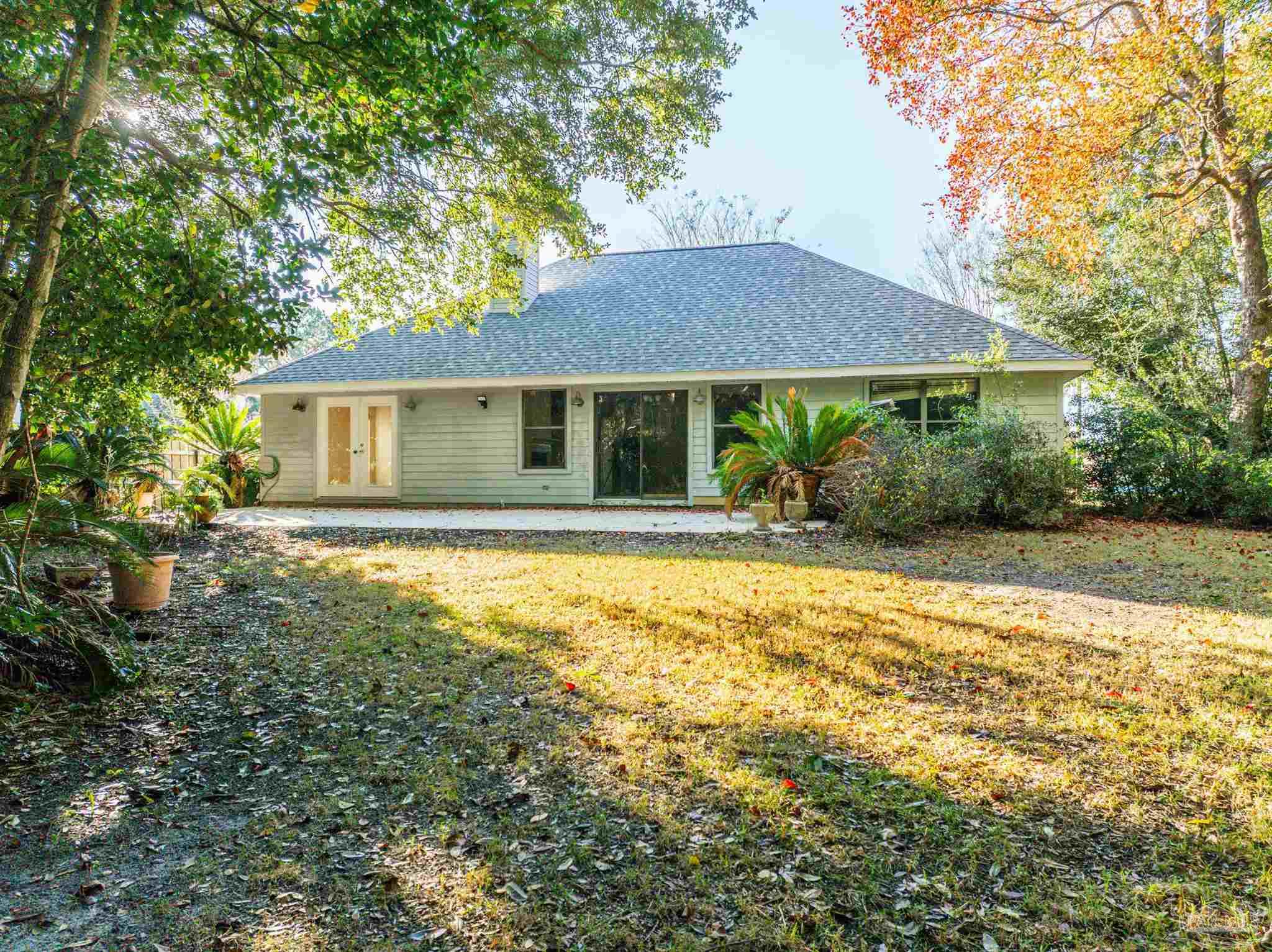 1860 Sparrow Lane Navarre, FL 32566 - Photo 15 of 43 a house view with a garden space