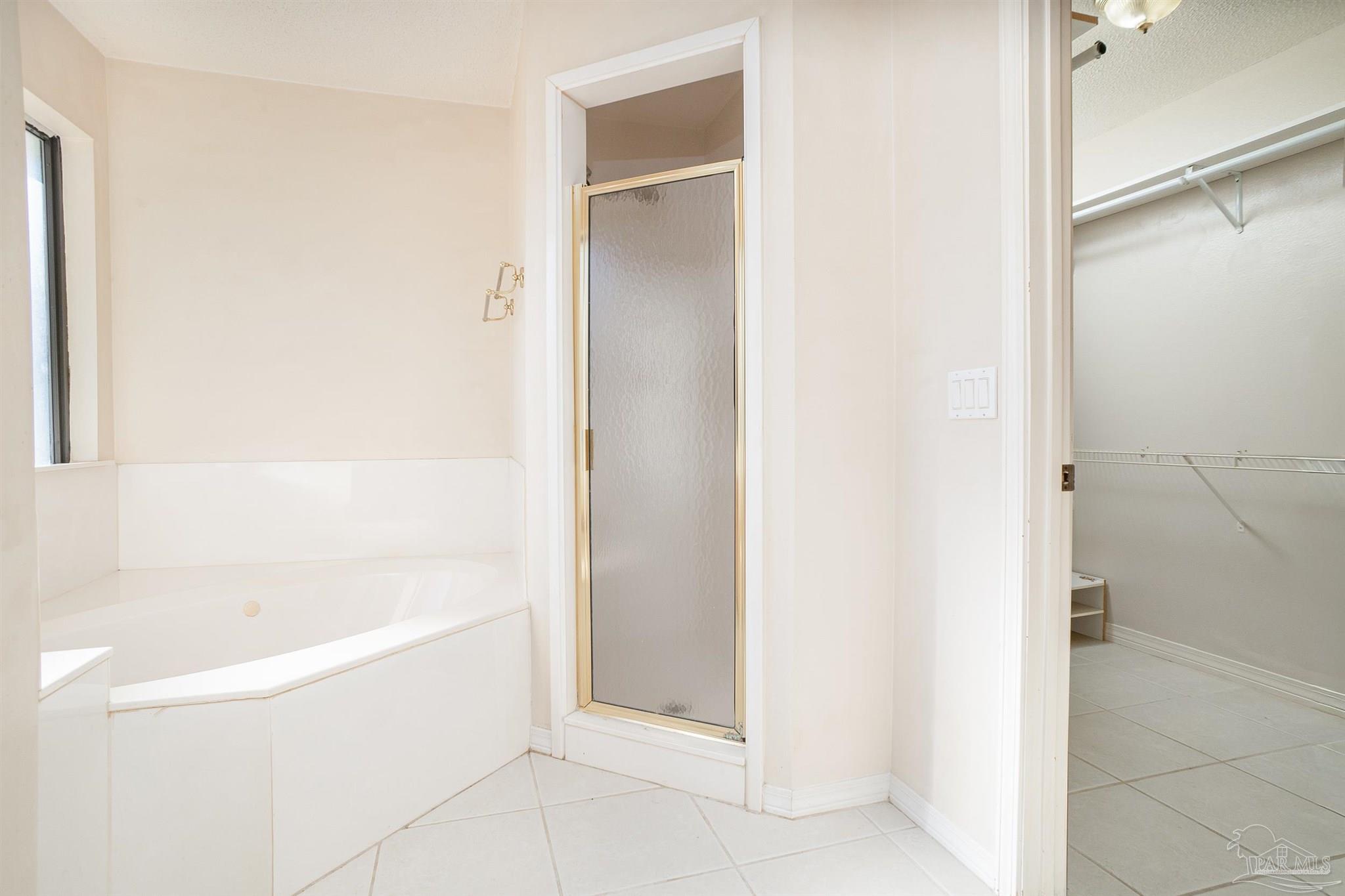 1860 Sparrow Lane Navarre, FL 32566 - Photo 32 of 43 a white bath tub sitting next to a white sink