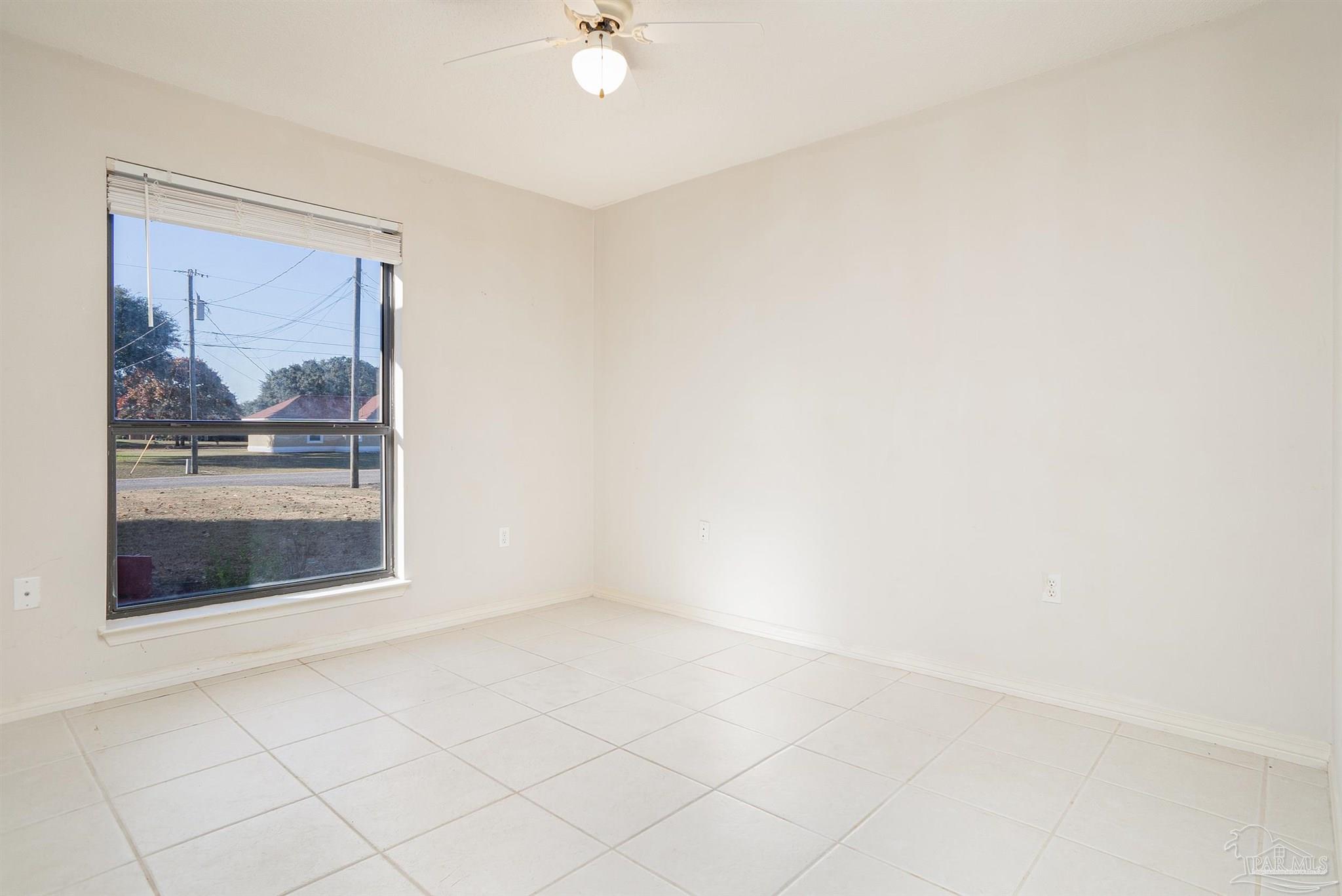1860 Sparrow Lane Navarre, FL 32566 - Photo 35 of 43 a view of an empty room with a window