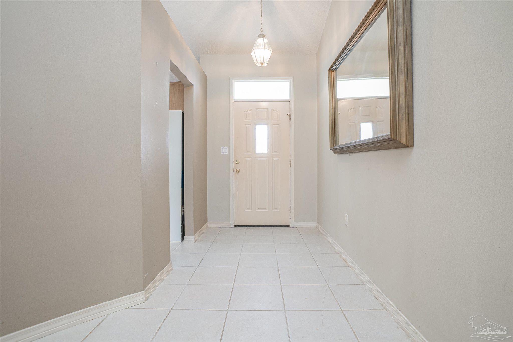 1860 Sparrow Lane Navarre, FL 32566 - Photo 41 of 43 an empty room with windows and closet