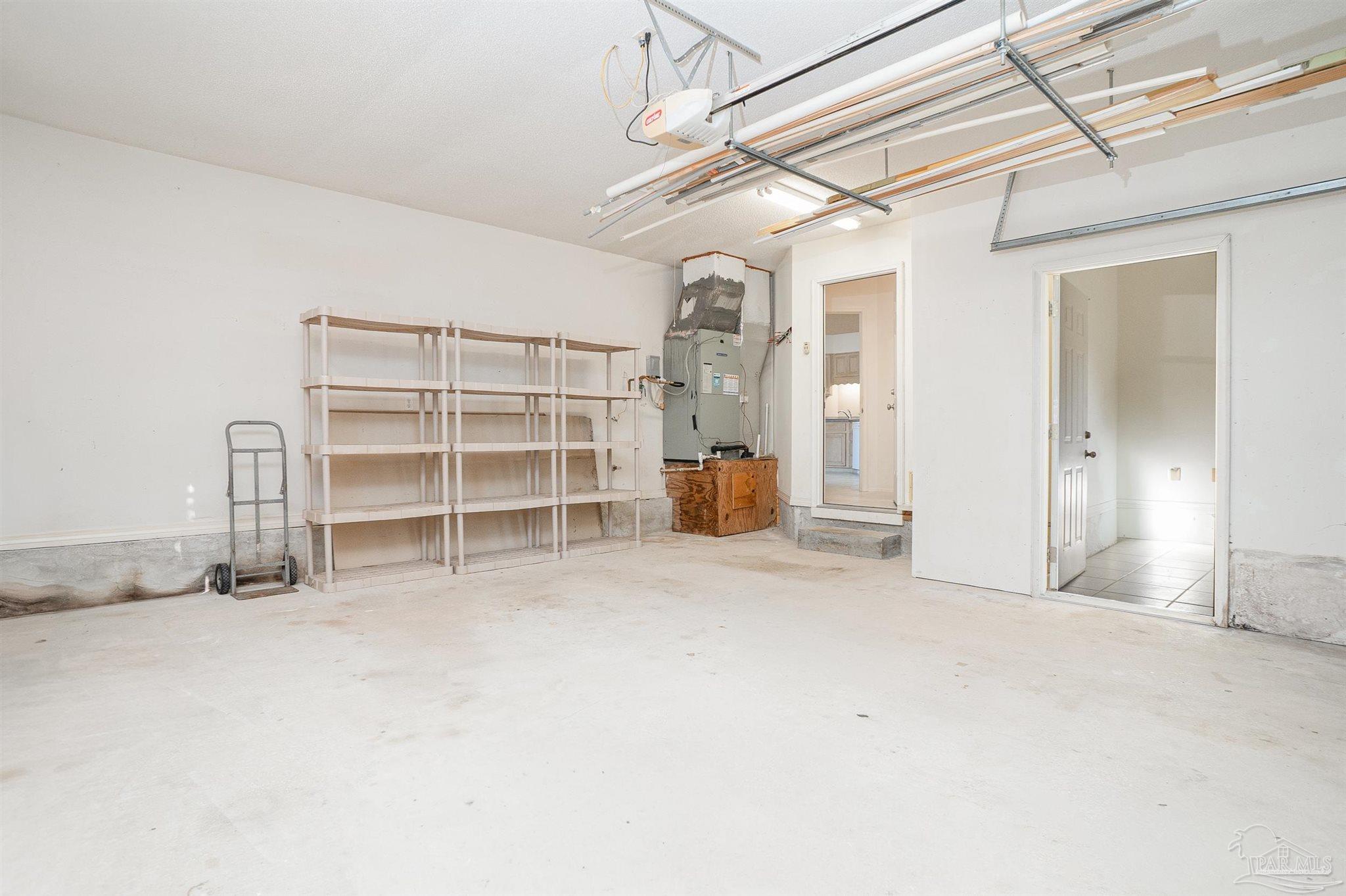 1860 Sparrow Lane Navarre, FL 32566 - Photo 42 of 43 a view of empty room with wooden floor and windows