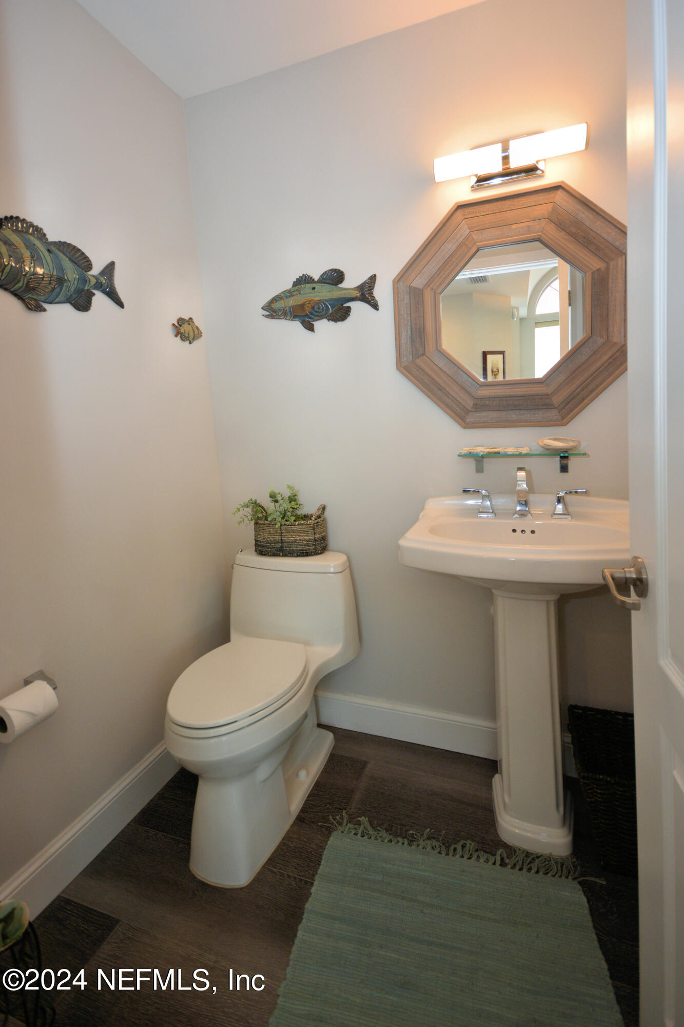 2740 Harbor Court St. Augustine, FL 32084 - Photo 18 of 53 a bathroom with a toilet sink and mirror