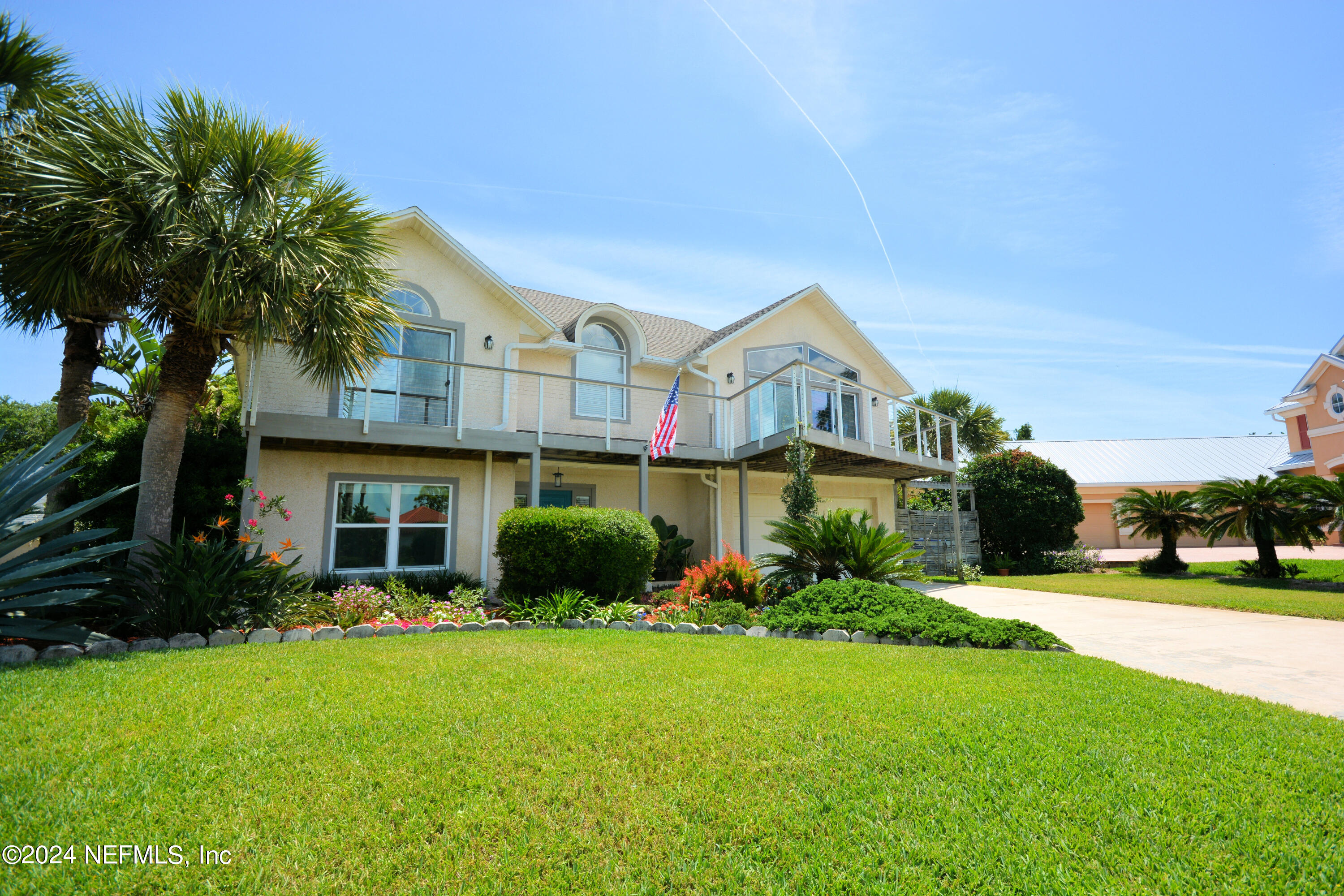 2740 Harbor Court St. Augustine, FL 32084 - Photo 32 of 53 a front view of a house with a yard and potted plants