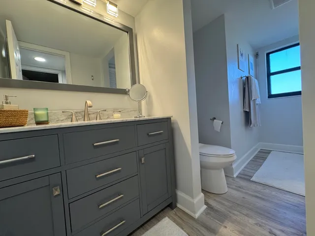 a view of a dining room with furniture and window