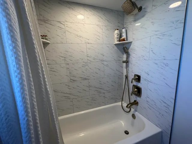 a kitchen with a refrigerator and a counter top