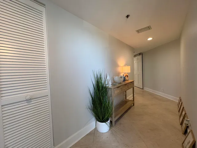 a bedroom with a bed and a mirror