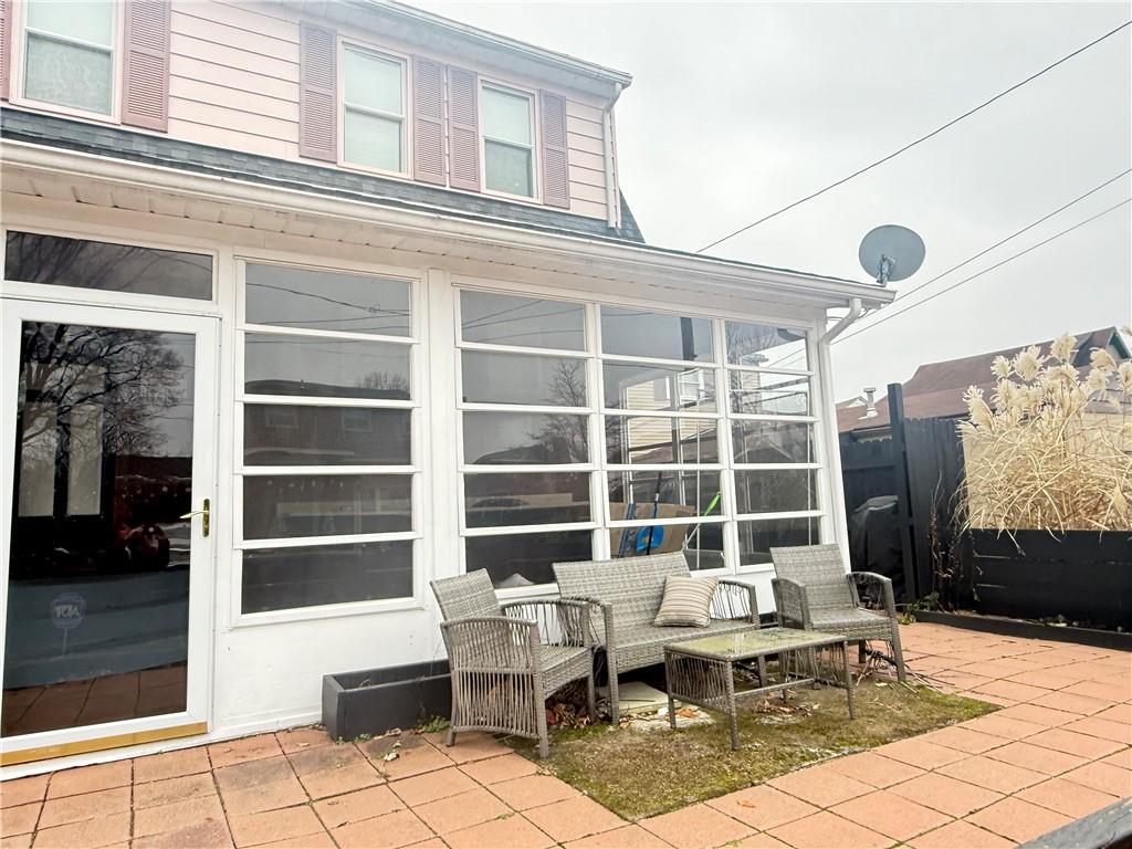 389 Webster Street Rochester, PA 15074 - Photo 21 of 24 Quaint patio-deck off of sun room.