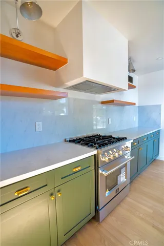 a kitchen with a stove and a microwave