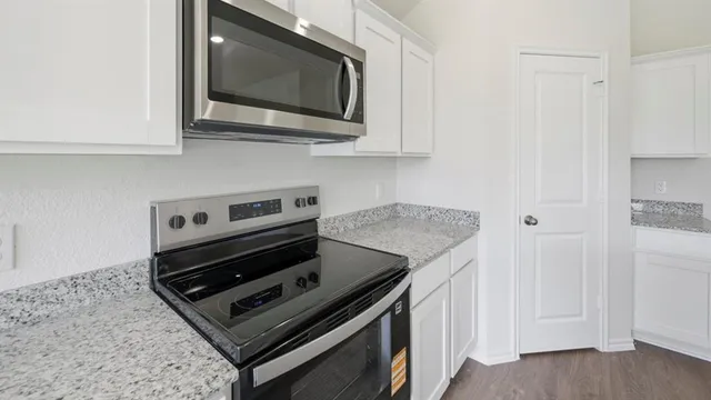 a view of a kitchen with wooden floor