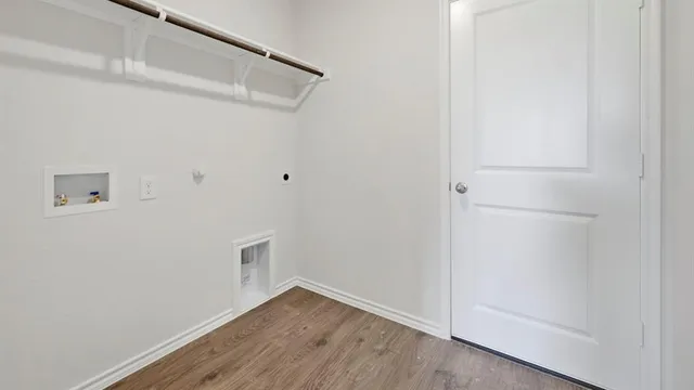 a view of kitchen with stainless steel appliances granite countertop a stove top oven a sink and a refrigerator