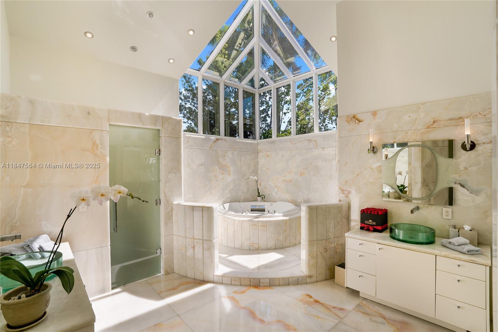 21034 Rosedown Court Boca Raton, FL 33433 - Photo 19 of 44 a bathroom with a sink a bath tub and a shower