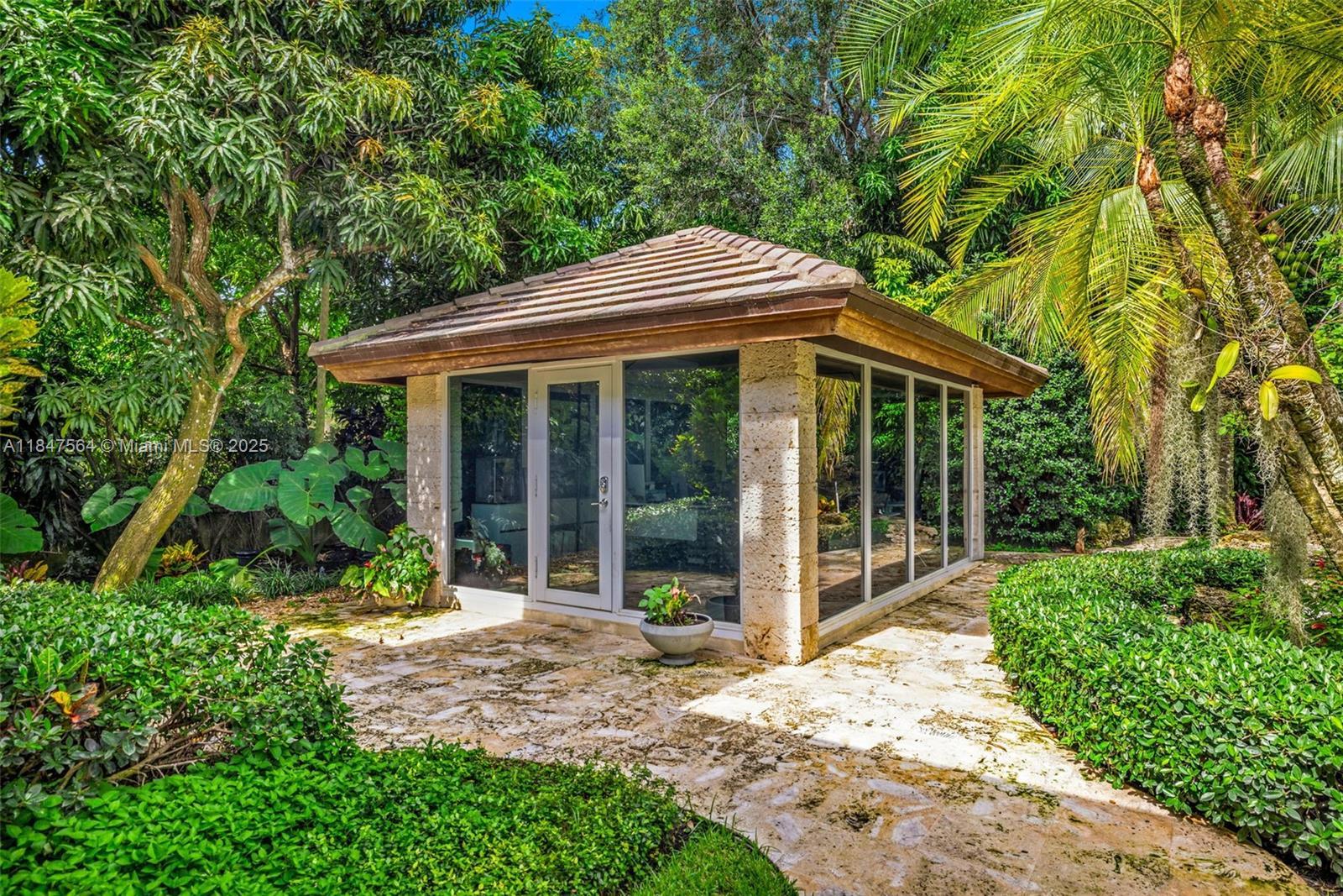 21034 Rosedown Court Boca Raton, FL 33433 - Photo 27 of 44 a front view of a house with a garden