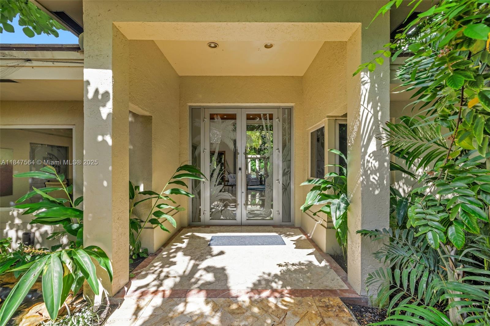 21034 Rosedown Court Boca Raton, FL 33433 - Photo 3 of 44 a entryway view with a garden
