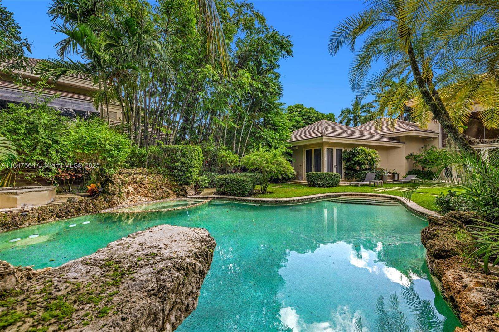 21034 Rosedown Court Boca Raton, FL 33433 - Photo 32 of 44 a view of a house with swimming pool and a yard