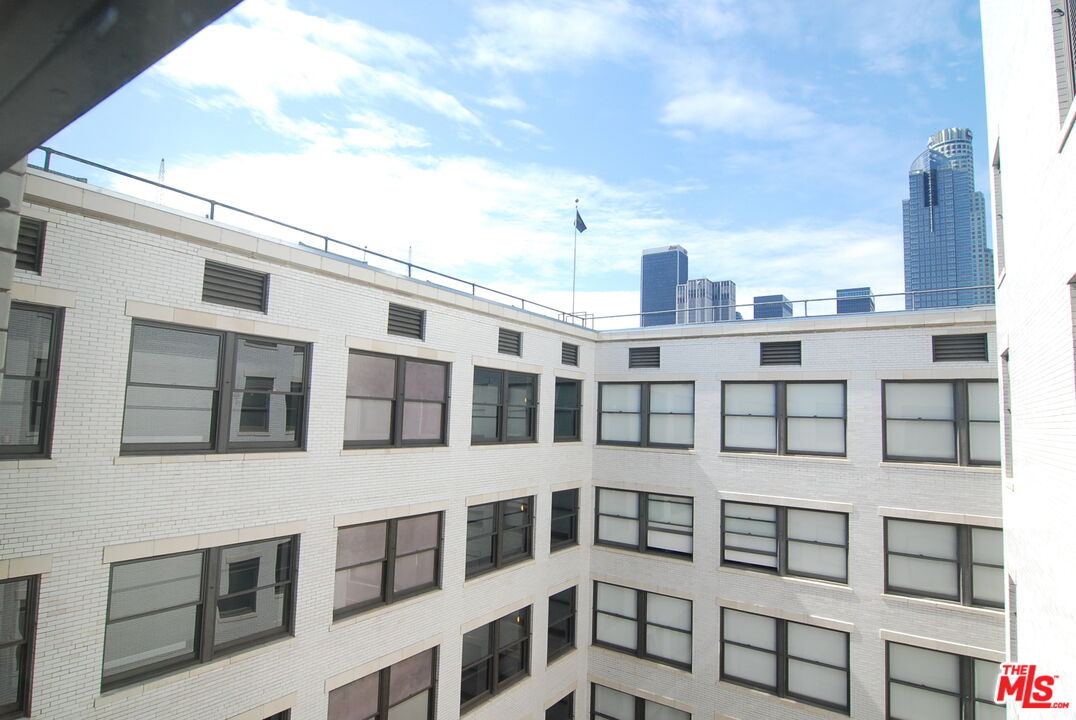 460 South Spring Street, Unit 608 Los Angeles, CA 90013 - Photo 20 of 31 a view of a building with a lot of windows