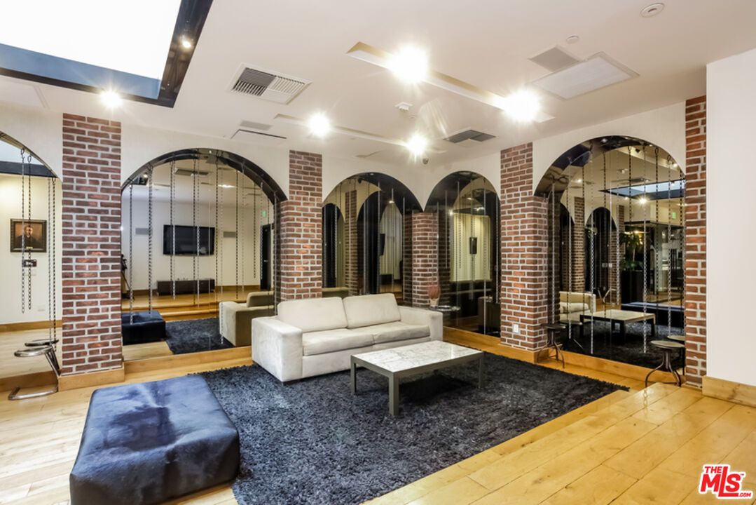 460 South Spring Street, Unit 608 Los Angeles, CA 90013 - Photo 28 of 31 a living room with furniture chandelier and window