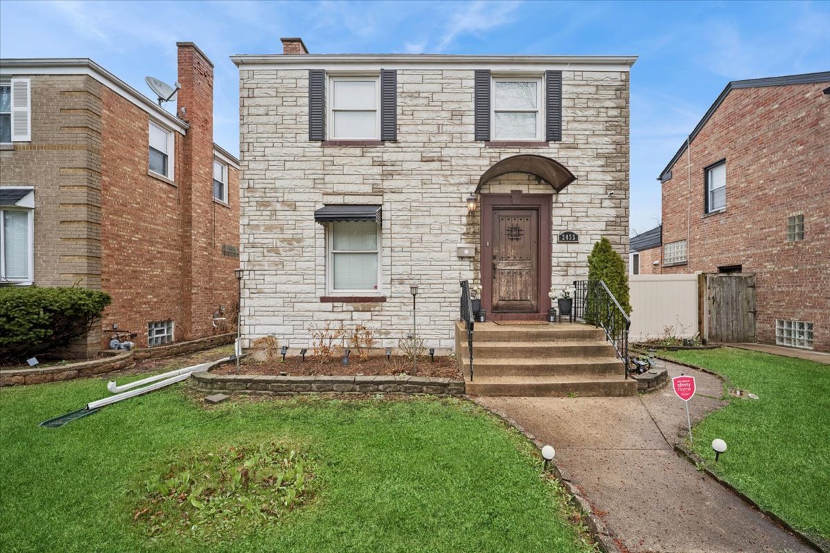 2455 North Rhodes Avenue River Grove, IL 60171 - Photo 1 of 24 a front view of a house with garden