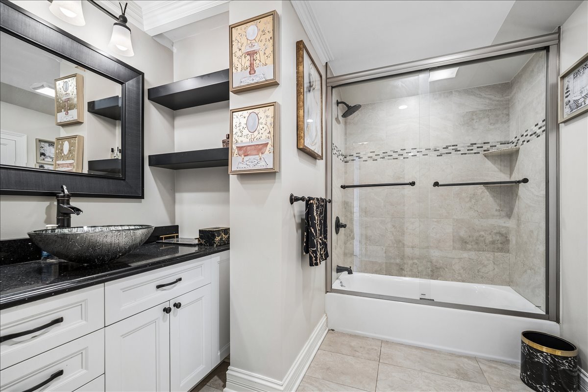 2455 North Rhodes Avenue River Grove, IL 60171 - Photo 14 of 24 a bathroom with a granite countertop shower sink and mirror